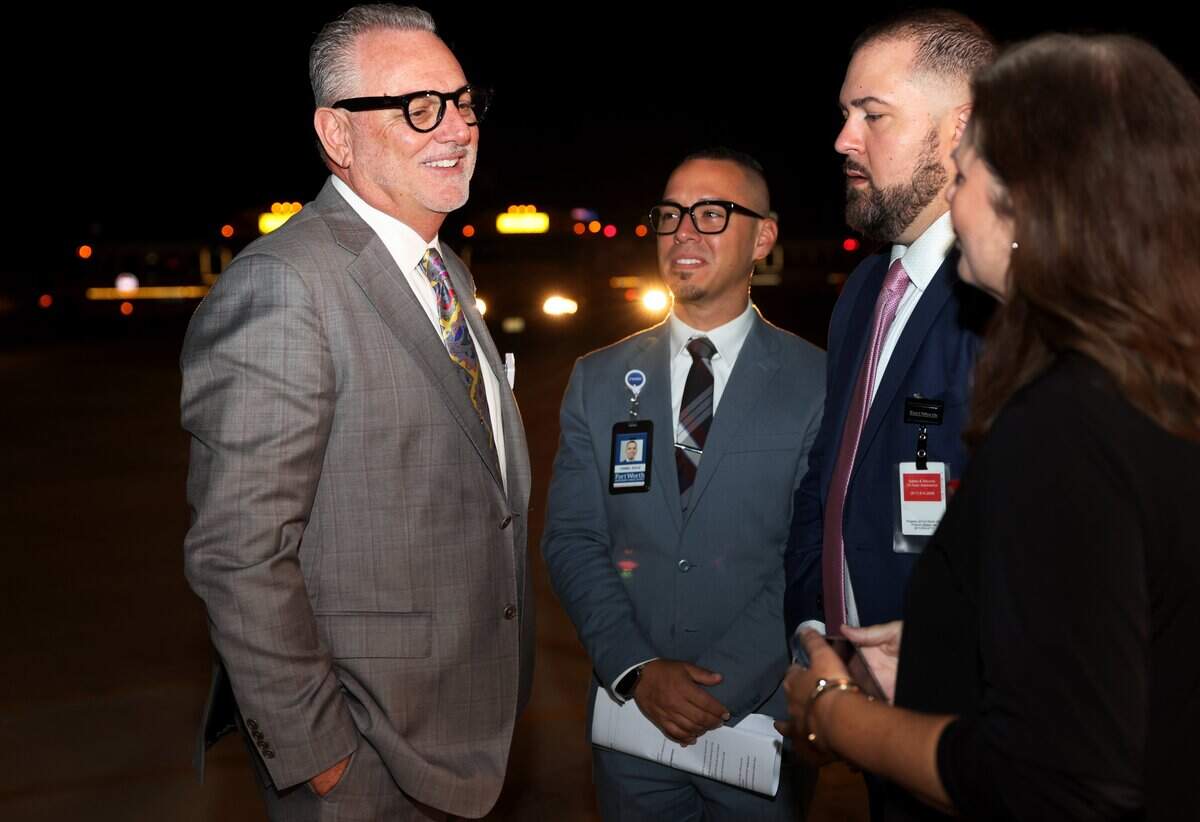 Fort Worth Independent School District Superintendent Peter Licata, left, talks to staff members while waiting to start his first day of school as the new superintendent on Monday, Aug. 10, 2026, in Fort Worth.